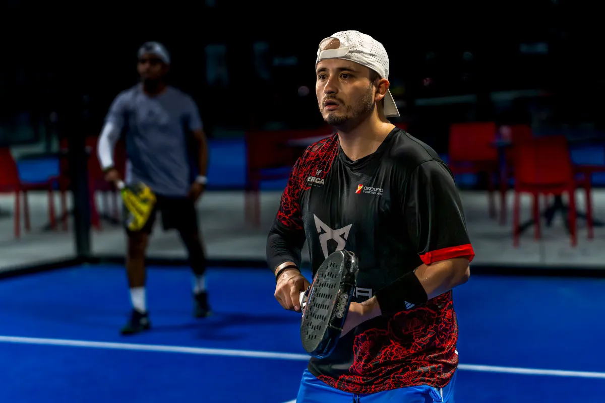 Two players in a doubles rally